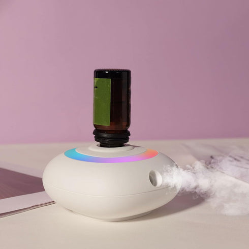 Mini Essential Oil Diffuser, Automatic Spraying Aromatherapy Diffuser with Rotating Colorful Lights and Timer Portable