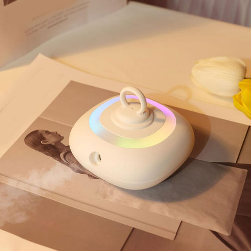 Mini Essential Oil Diffuser, Automatic Spraying Aromatherapy Diffuser with Rotating Colorful Lights and Timer Portable