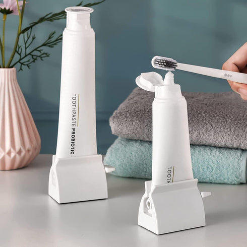JIAKAI 2pcs Rolling Tube Toothpaste Squeezer Toothpaste Seat Holder Stand for Bathroom AccessoriesMilky