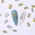SILPECWEE 20pcs Alloy Money Dollar Nail Charms, 3D Silver & Gold Dollar Sign Rhinestones Nail Art Charms for Women Nail