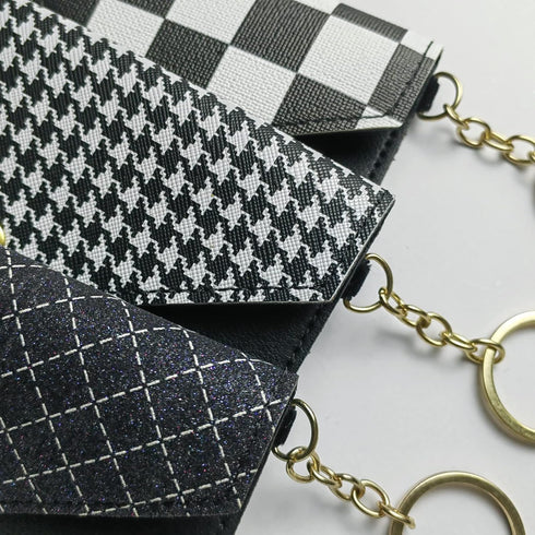 Stylish Black and White Envelope-Shaped Keychain for Birth Control Pills