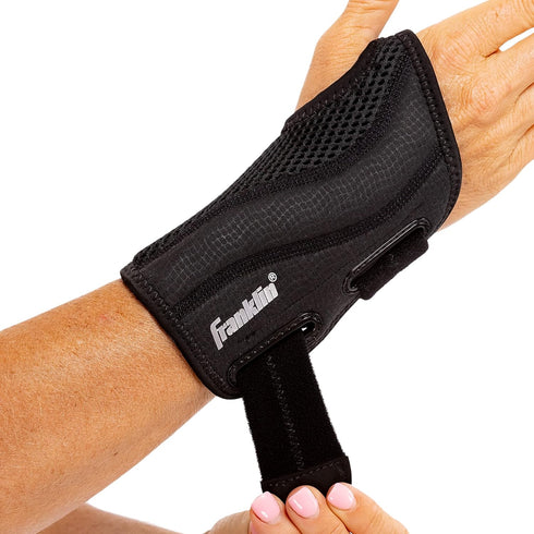 Franklin Sports Wrist Brace and Stabilizer, Adjustable Sports Wrist Guard for Pain Relief and Injury Prevention
